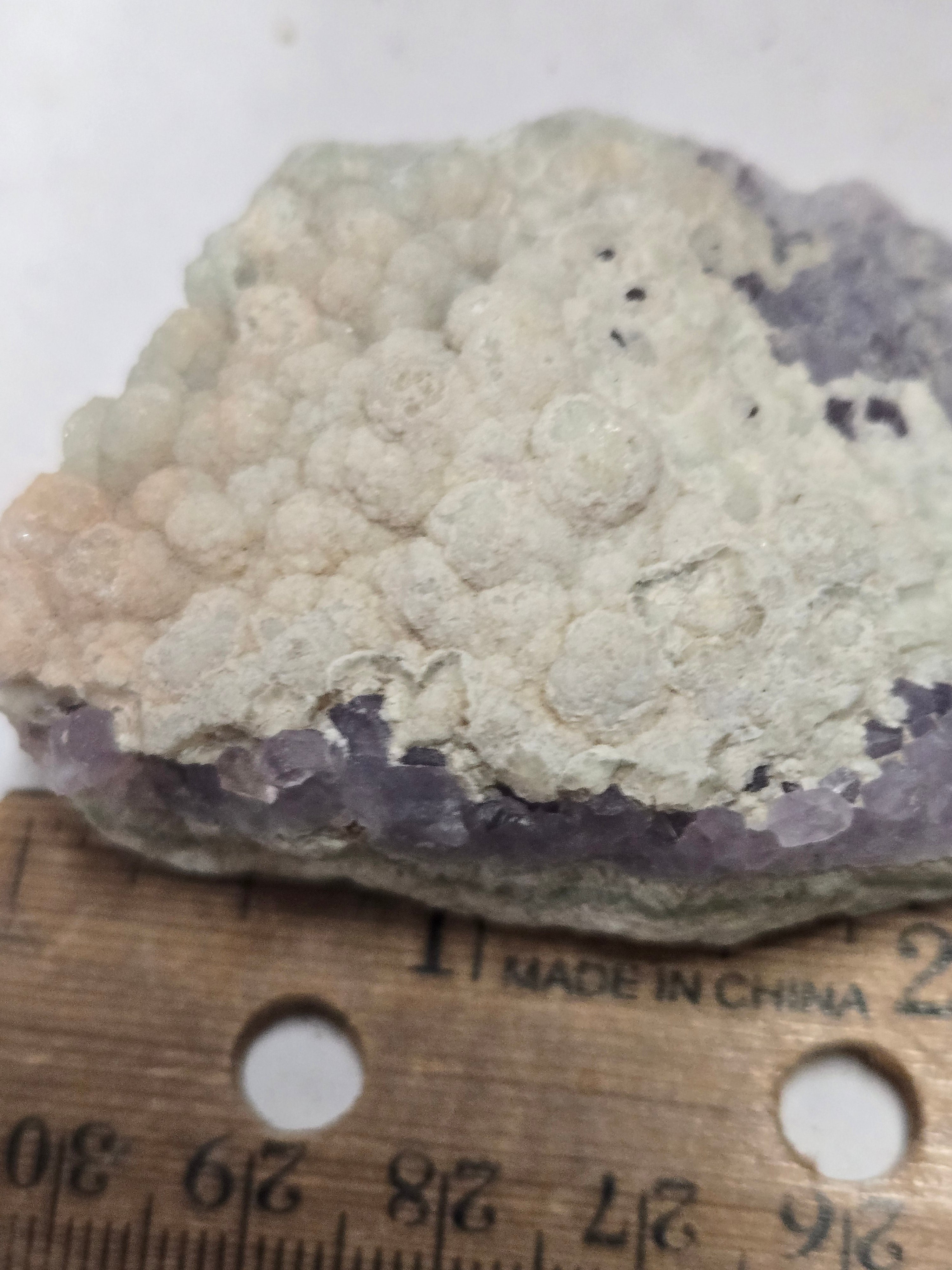 Botroidal fluorite on amethyst