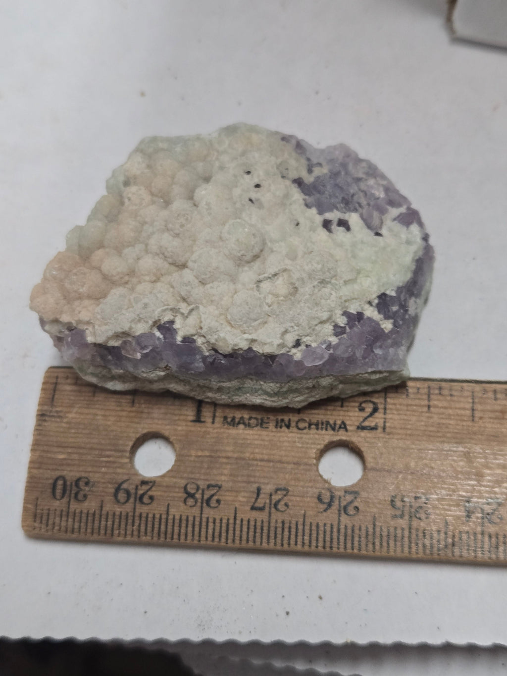Botroidal fluorite on amethyst