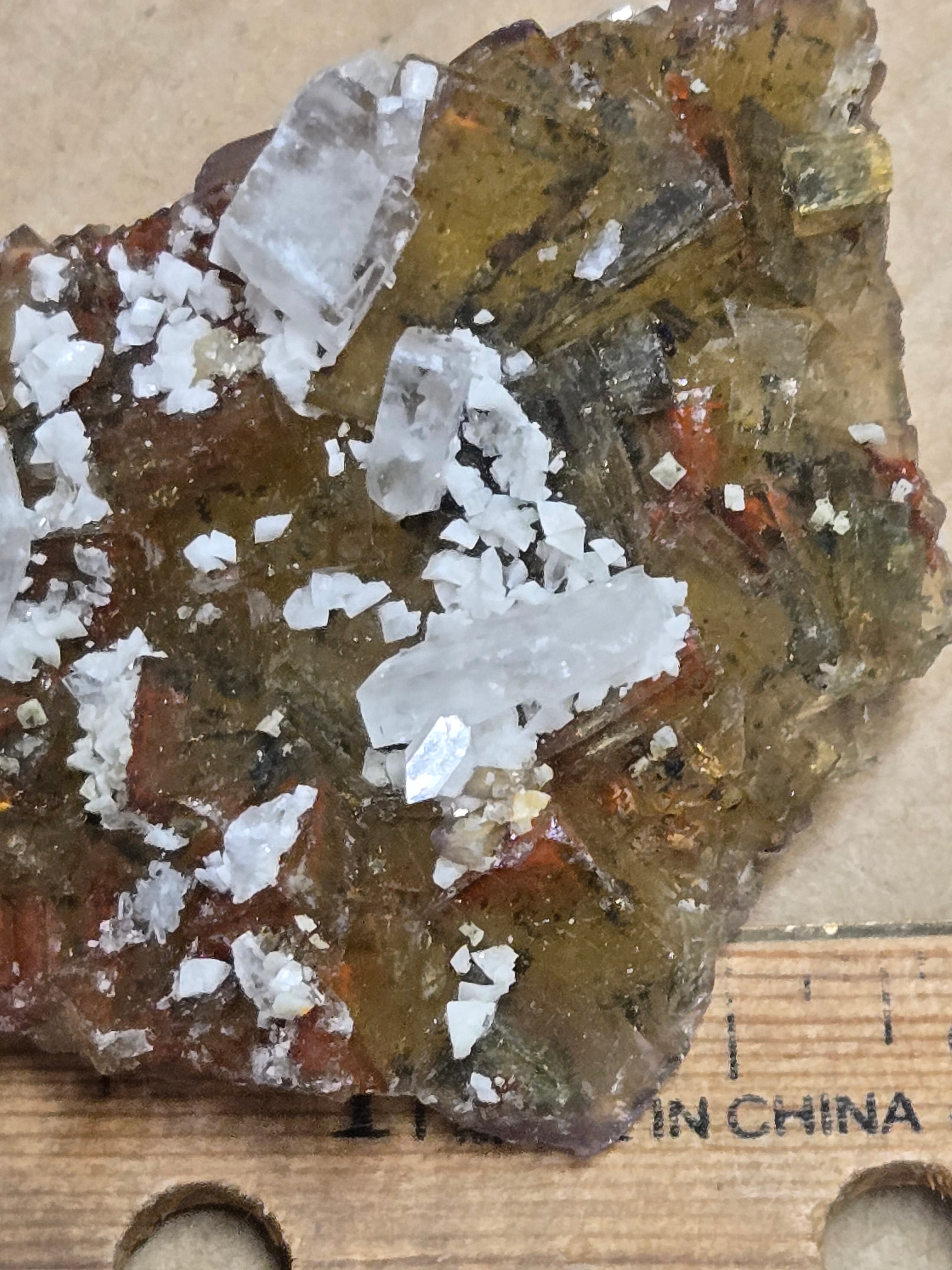 Dolomite calcite on yellow fluorite