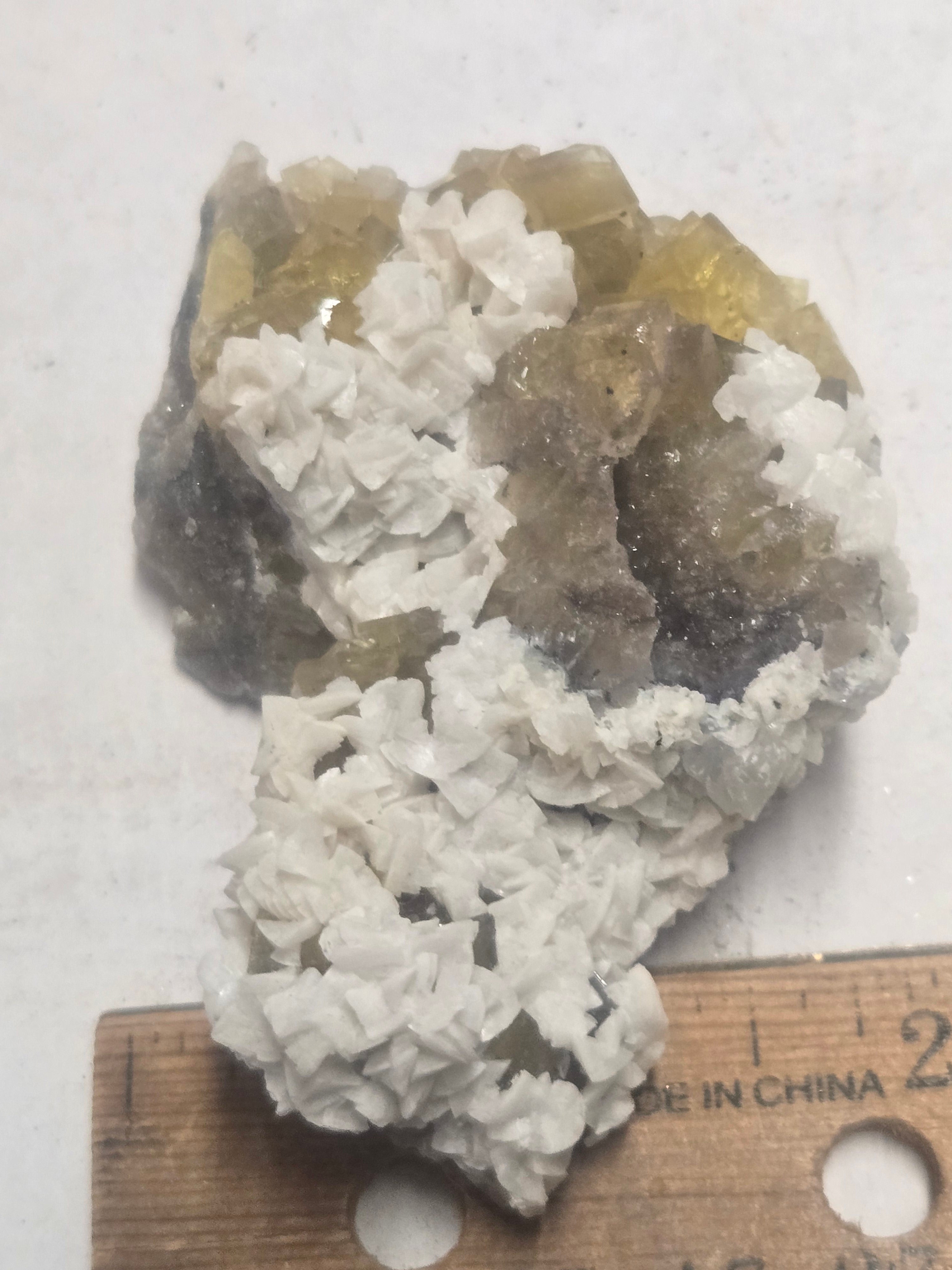 Dolomite on yellow fluorite