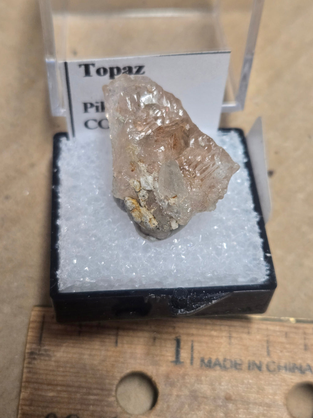 Etched topaz crystal
