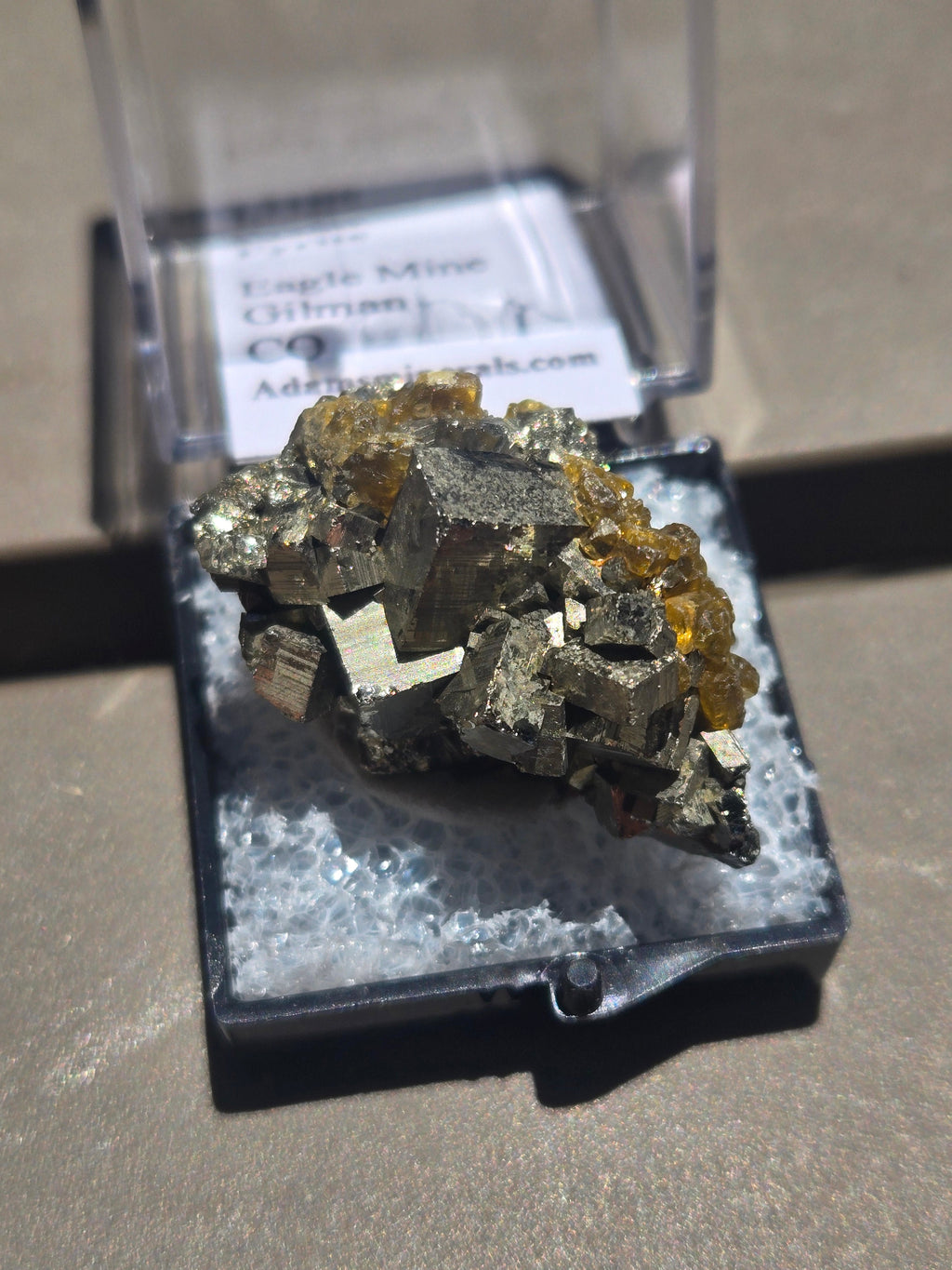Golden barite on Pyrite