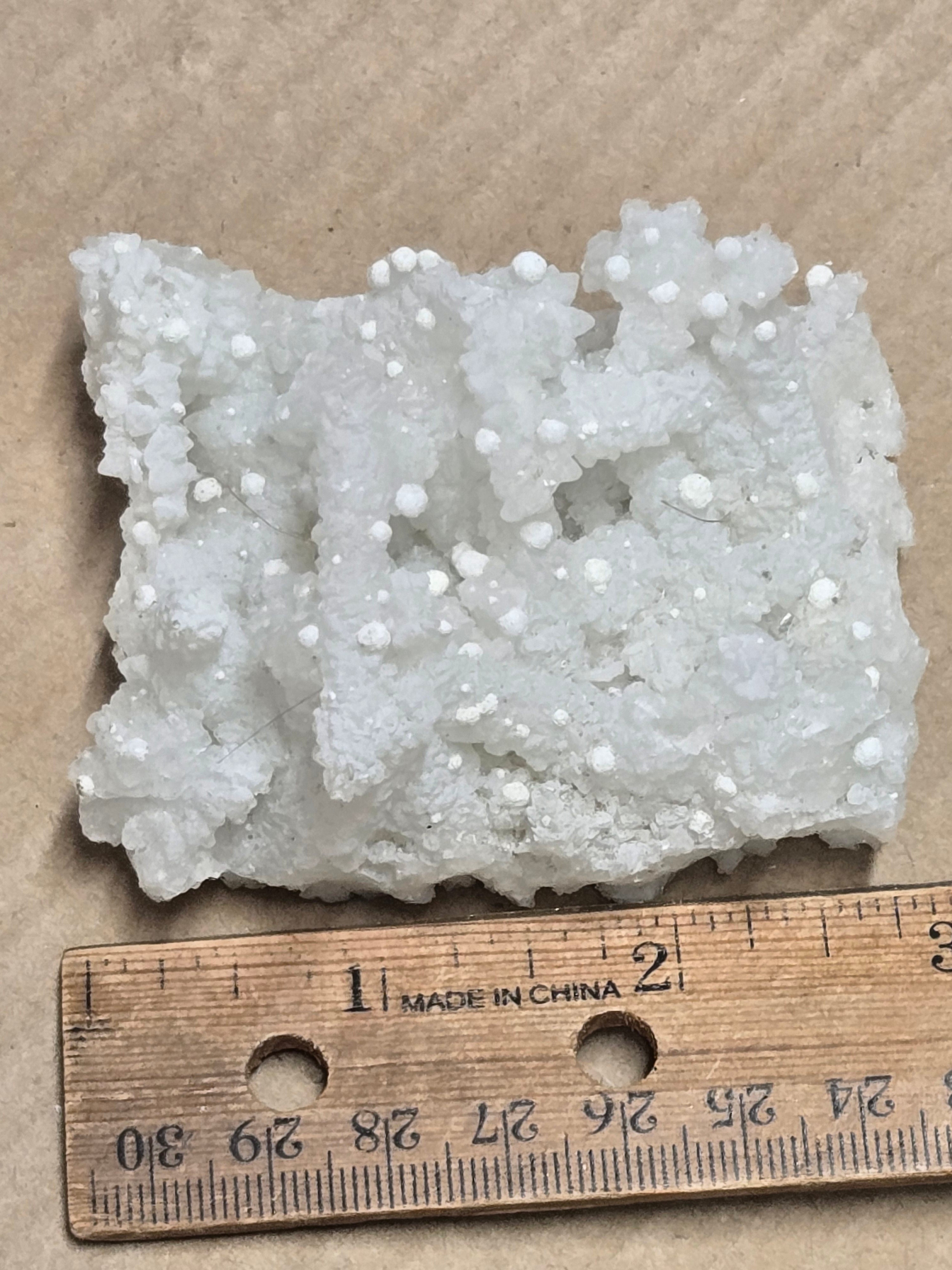 Gyrolite on prehnite after laumontite