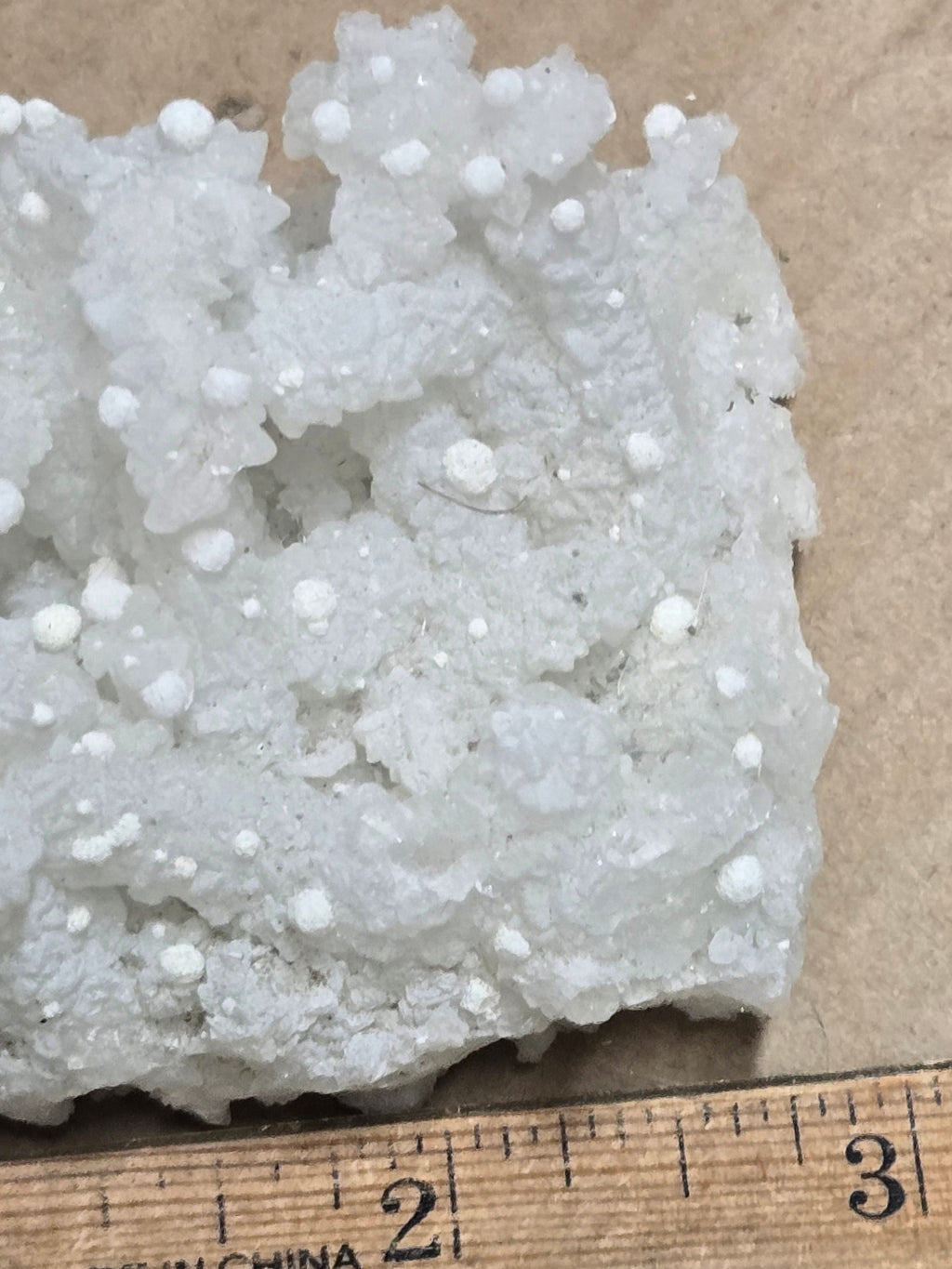 Gyrolite on prehnite after laumontite