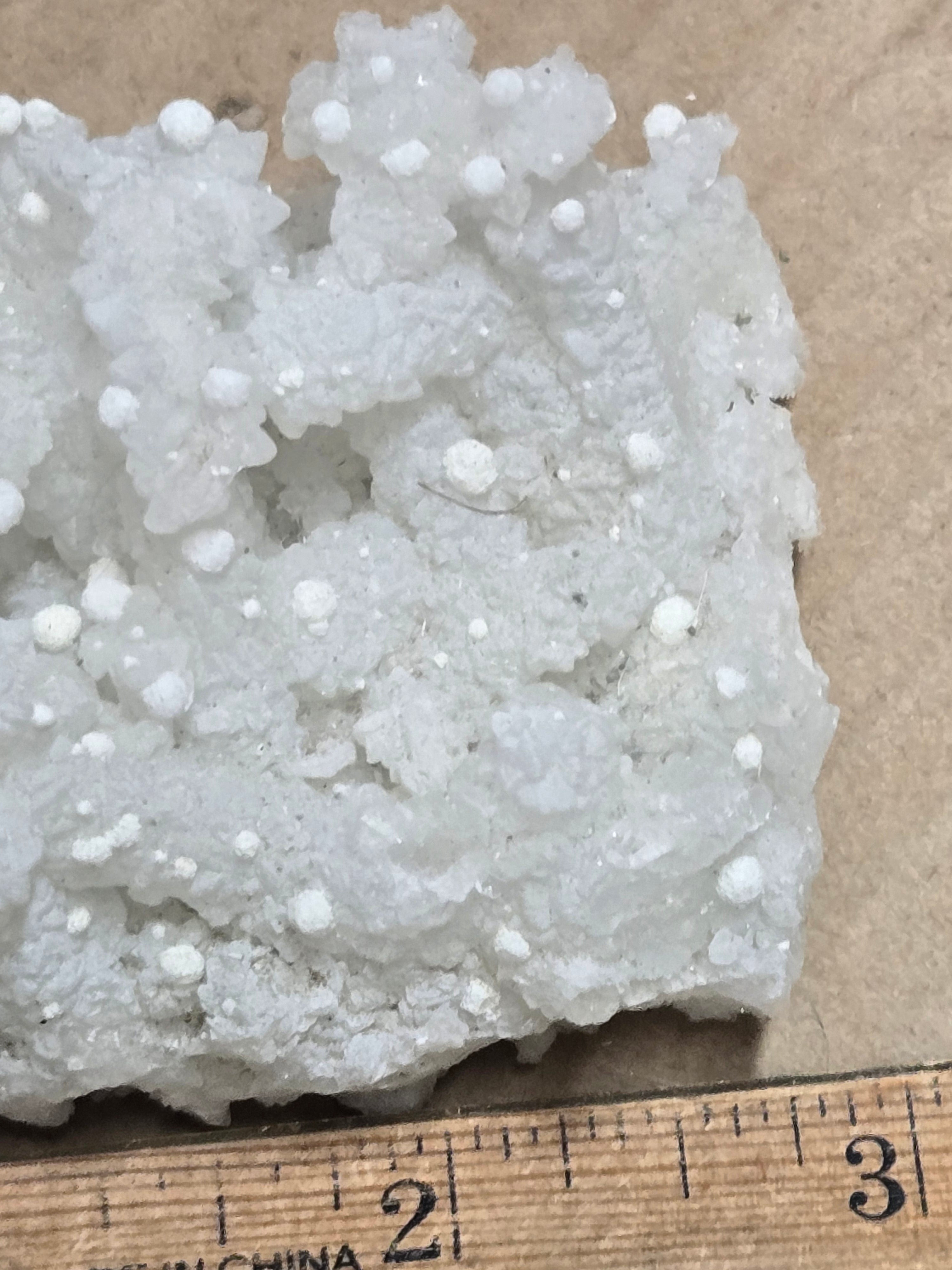 Gyrolite on prehnite after laumontite