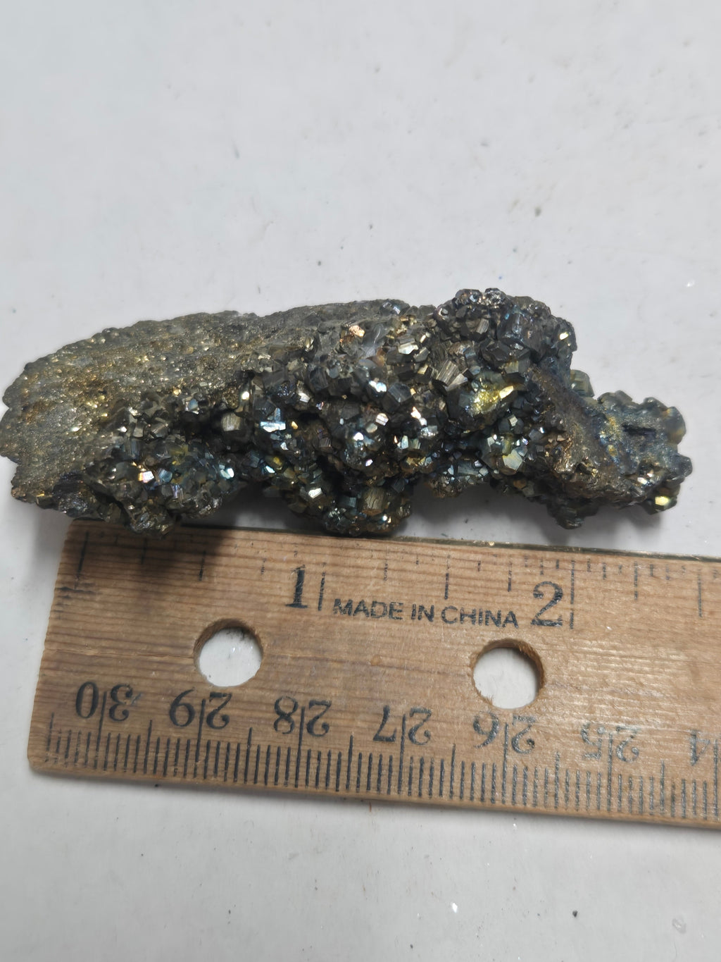 Iridescent pyrite cluster