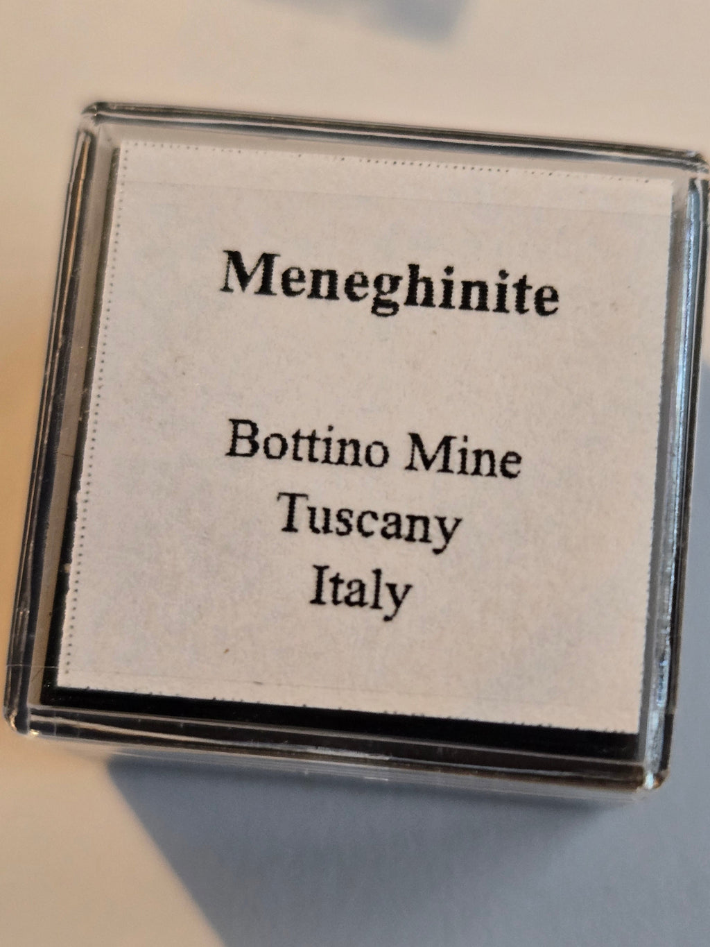 Meneghinite