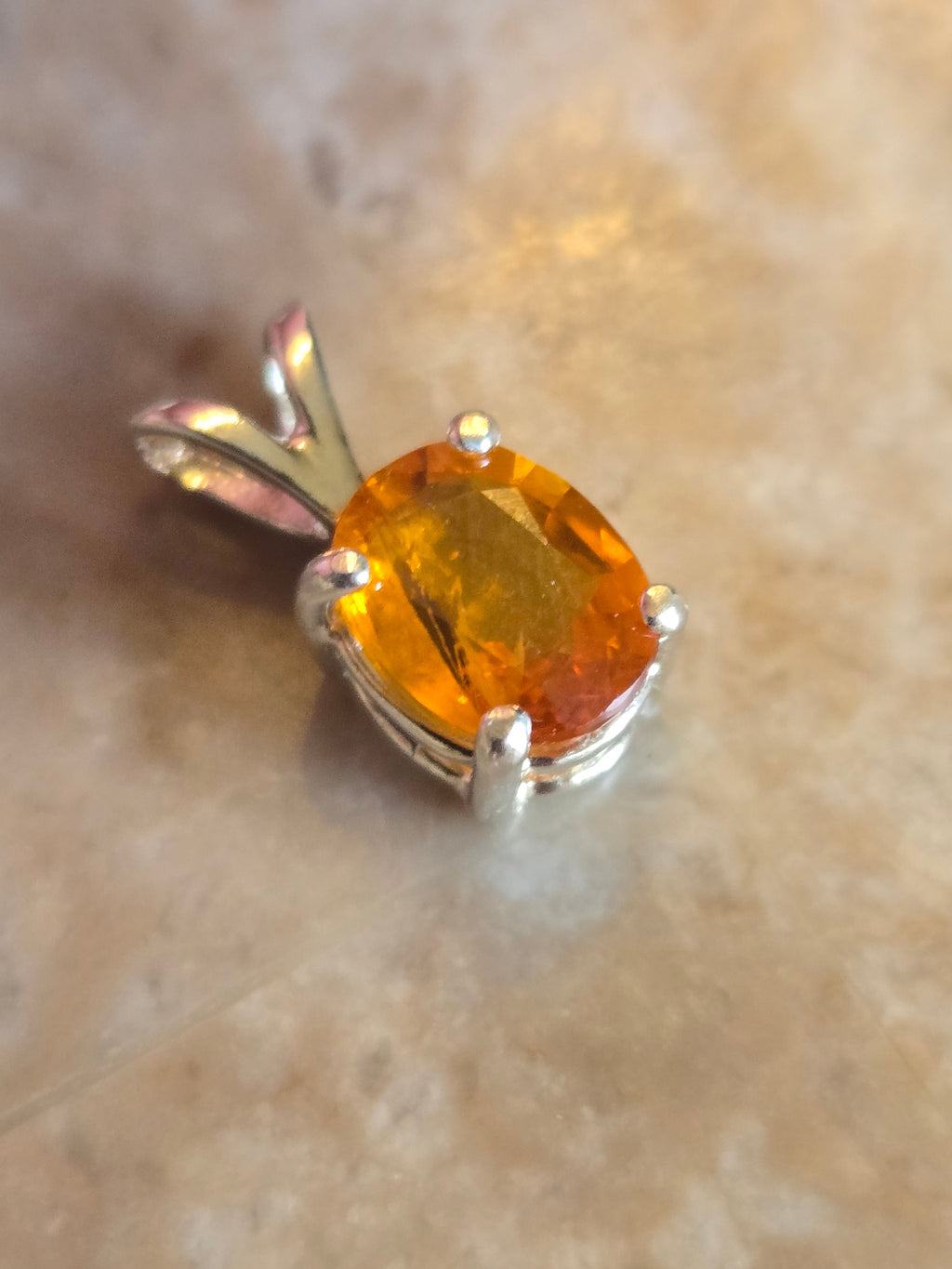 Orange sapphire pendant