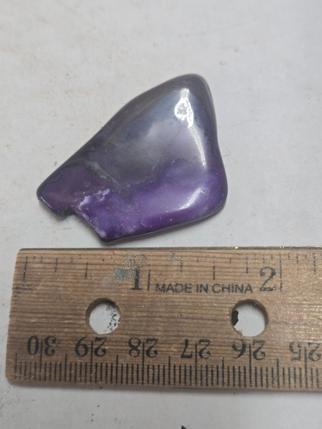 Polished sugilite