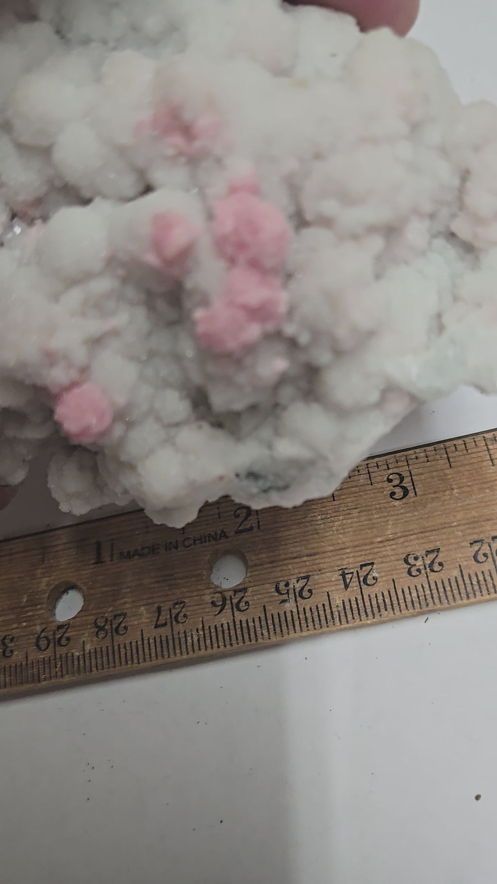 Rhodochrosite on quartz specimen