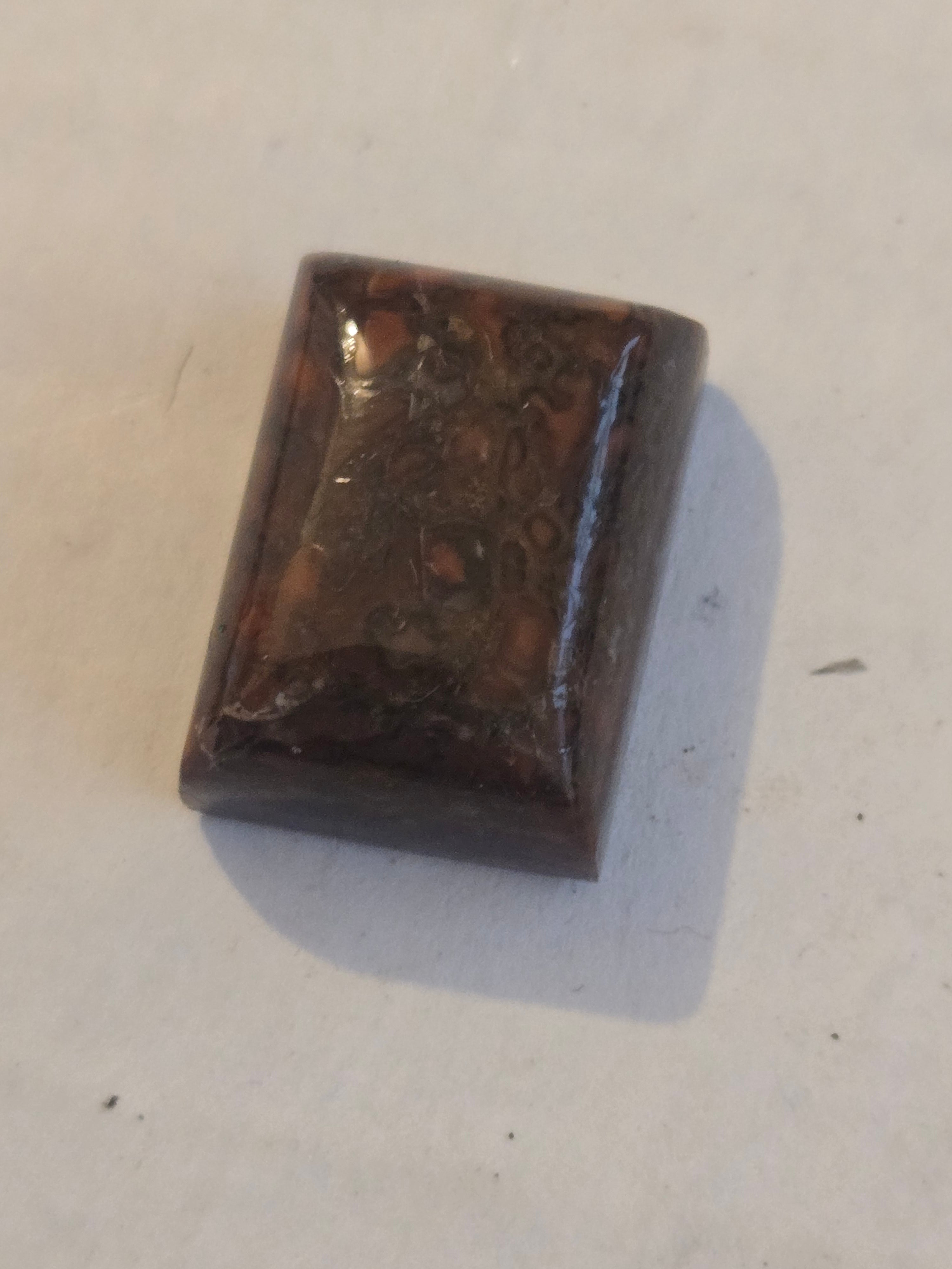 Red dinosaur bone cabochon
