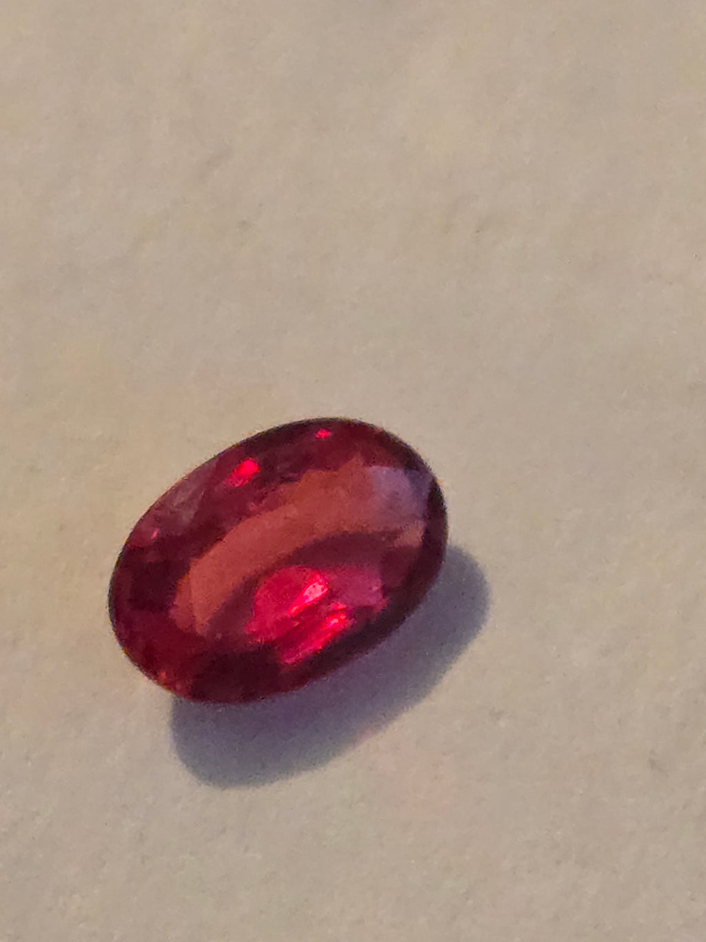 Red sapphire facet