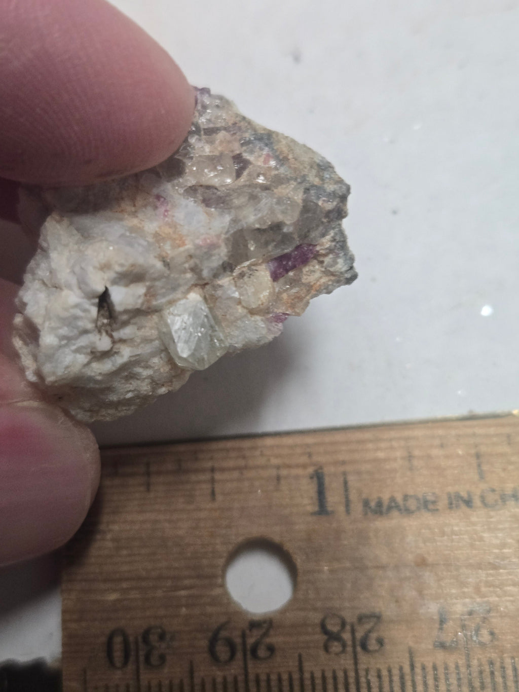 Rhodizite with tourmaliine