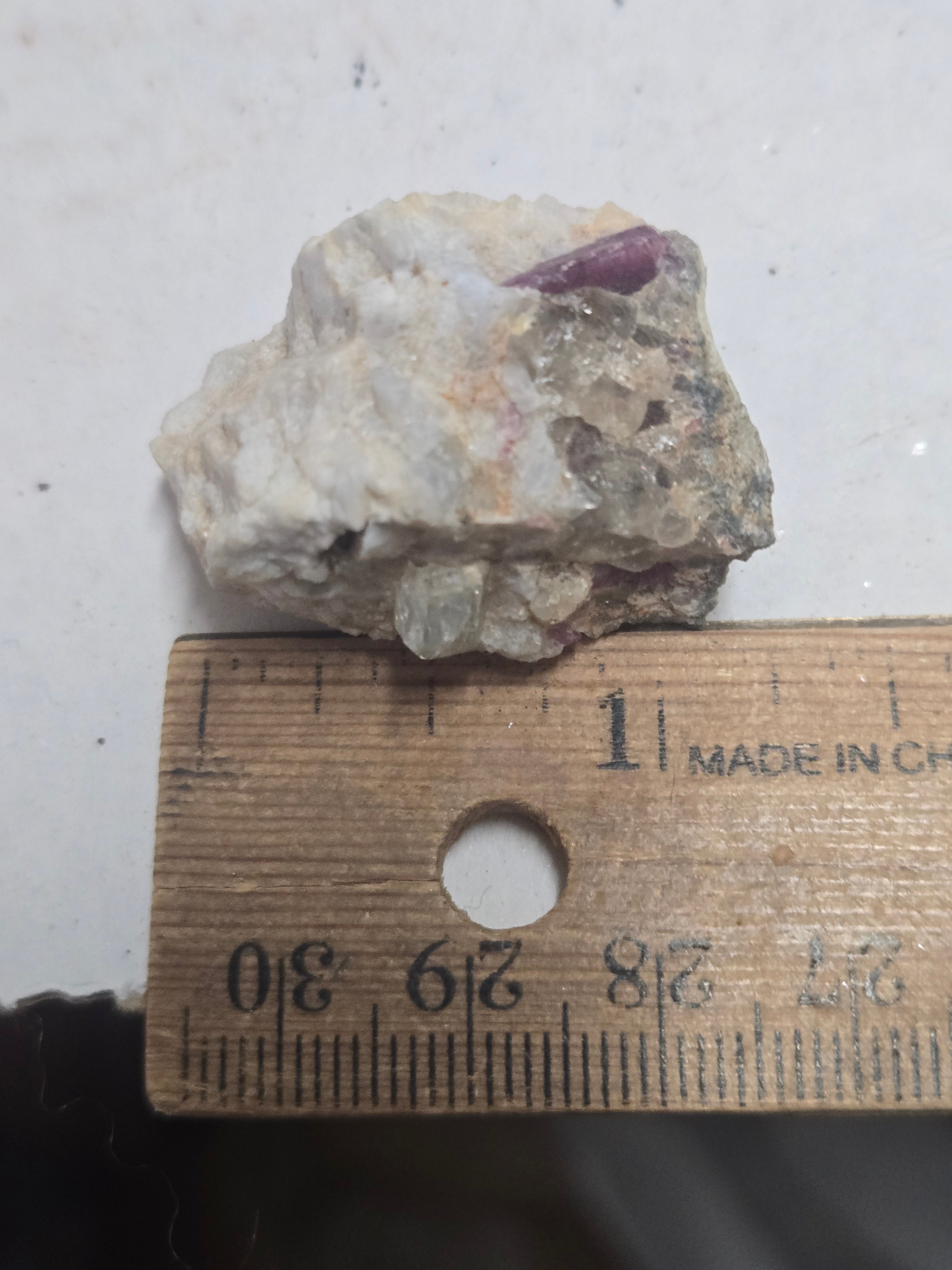 Rhodizite with tourmaliine