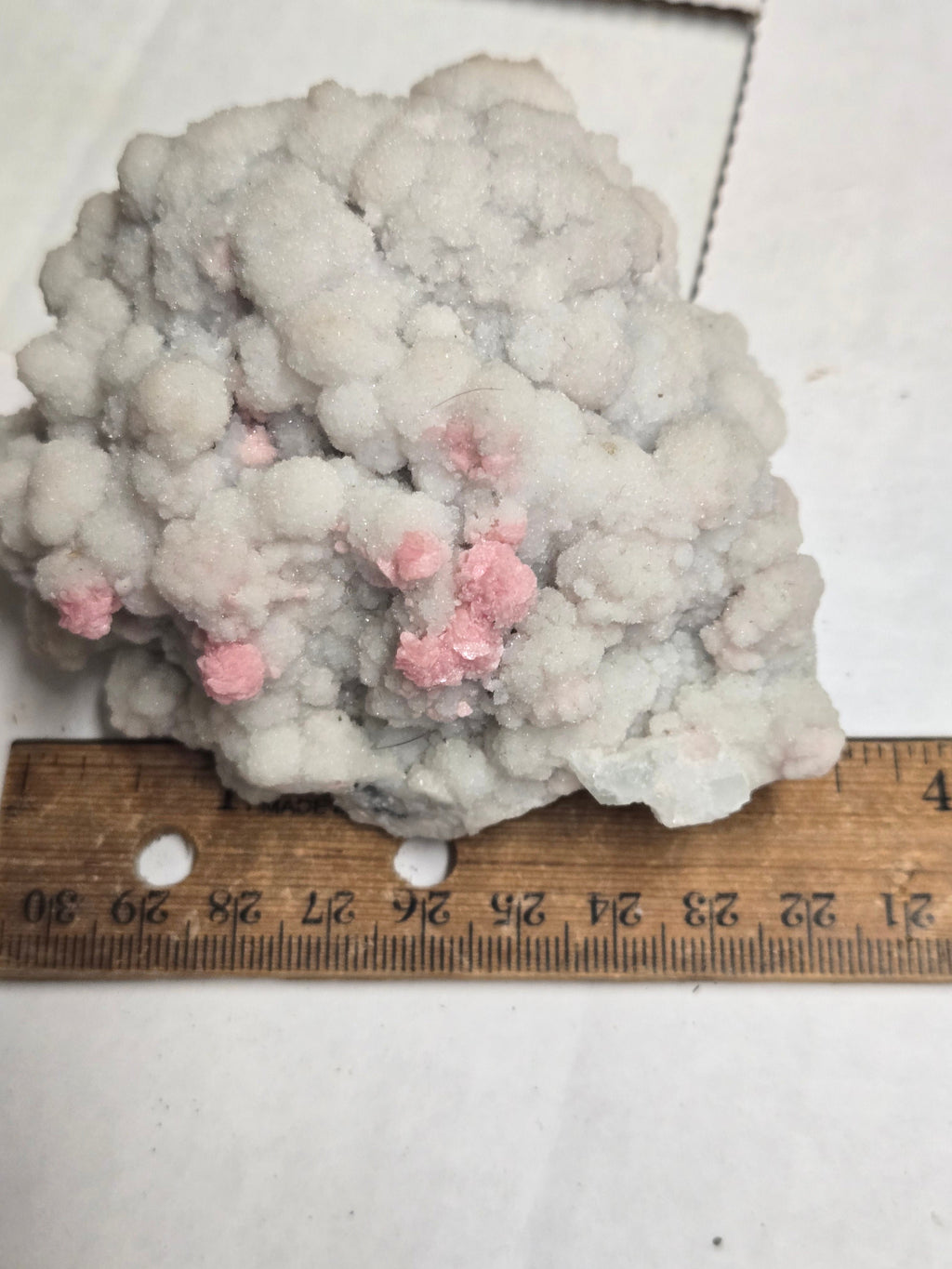 Rhodochrosite on quartz specimen