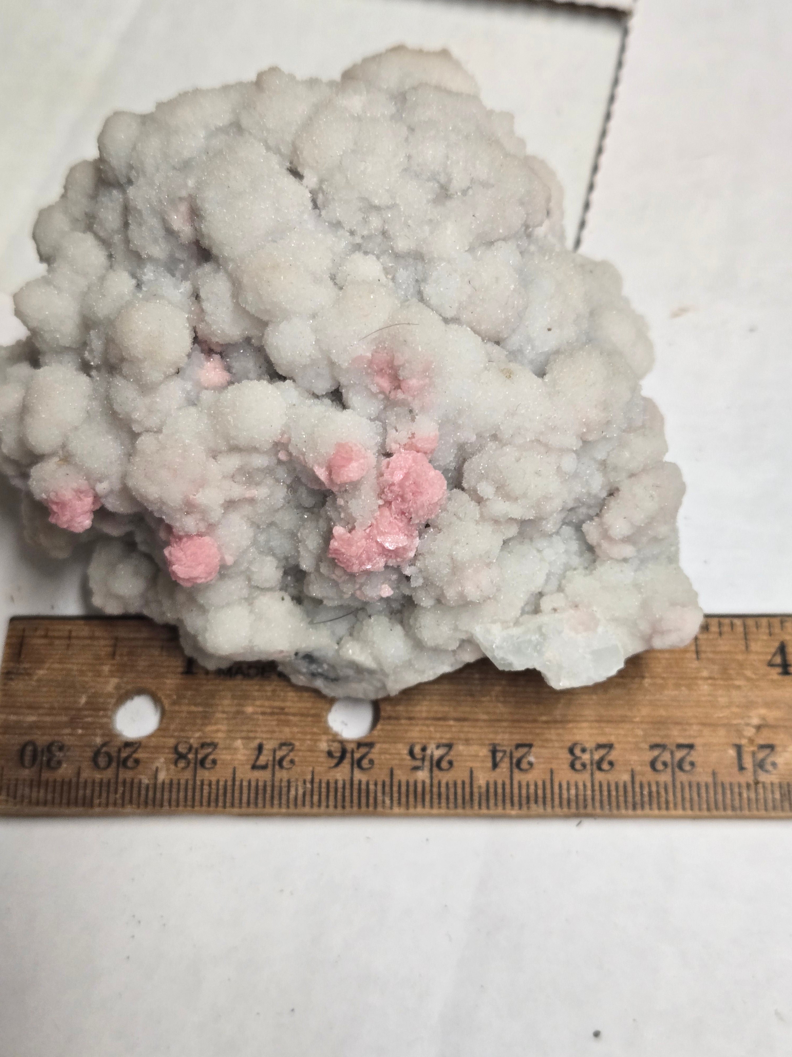 Rhodochrosite on quartz specimen