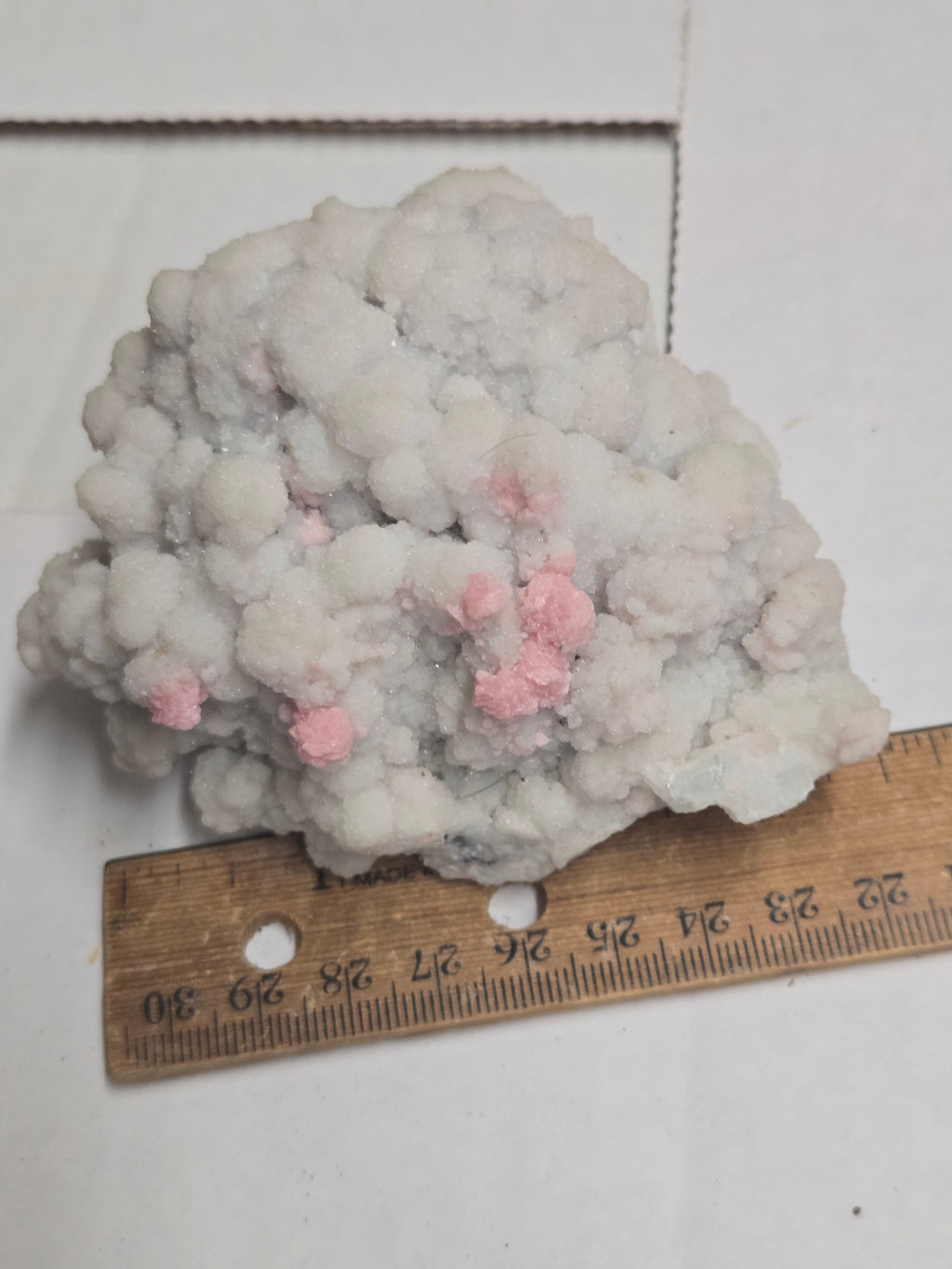 Rhodochrosite on quartz specimen
