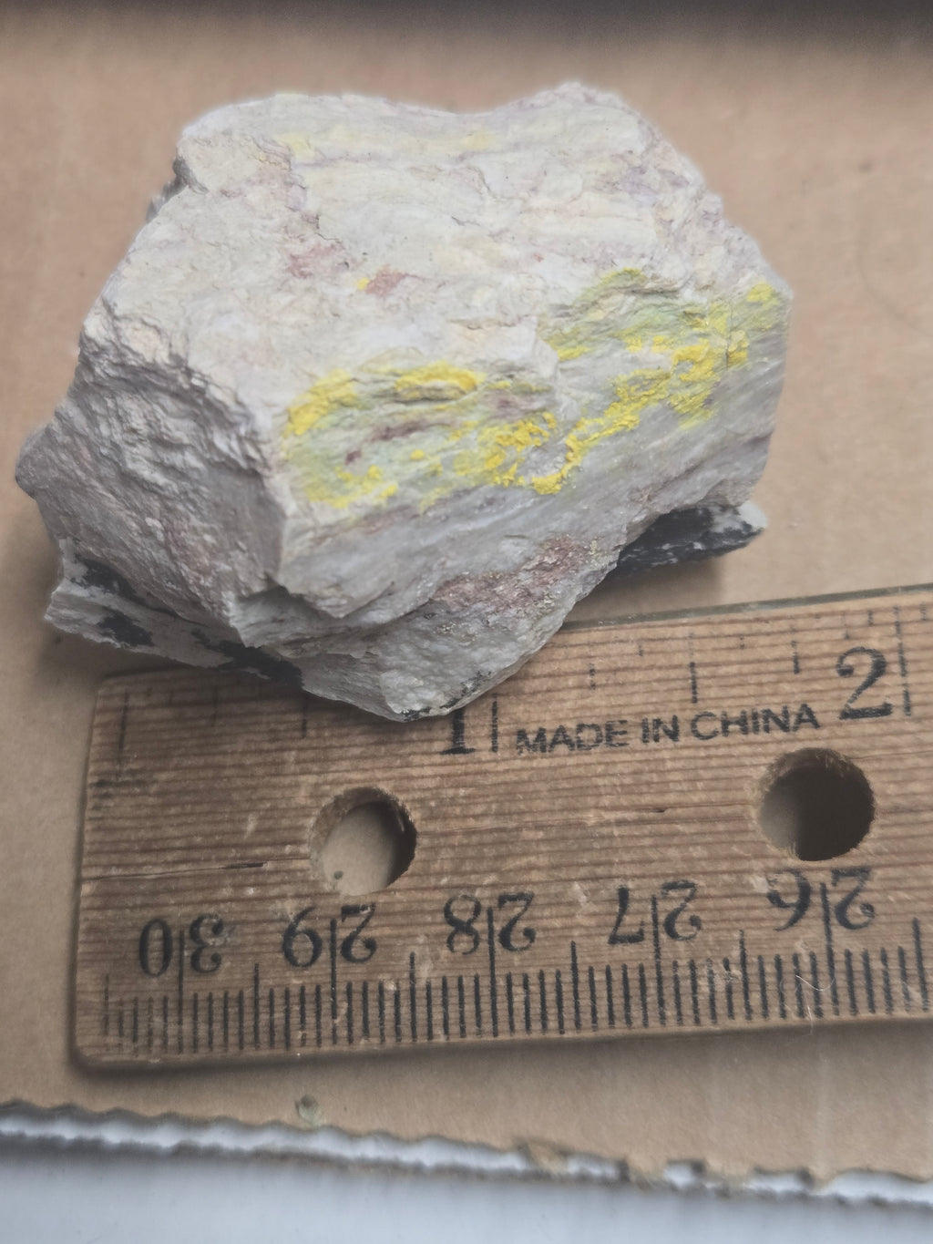 Carnotite weeksite specimen