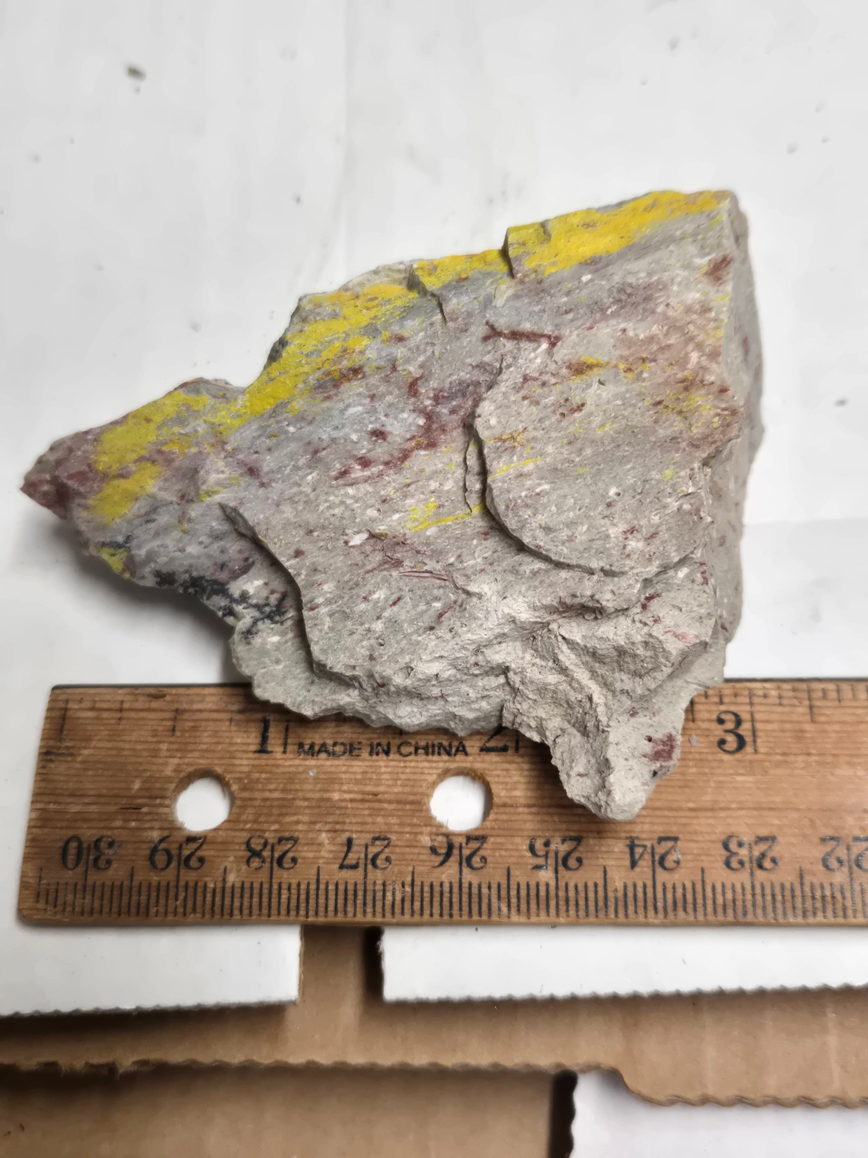 Carnotite weeksite specimen