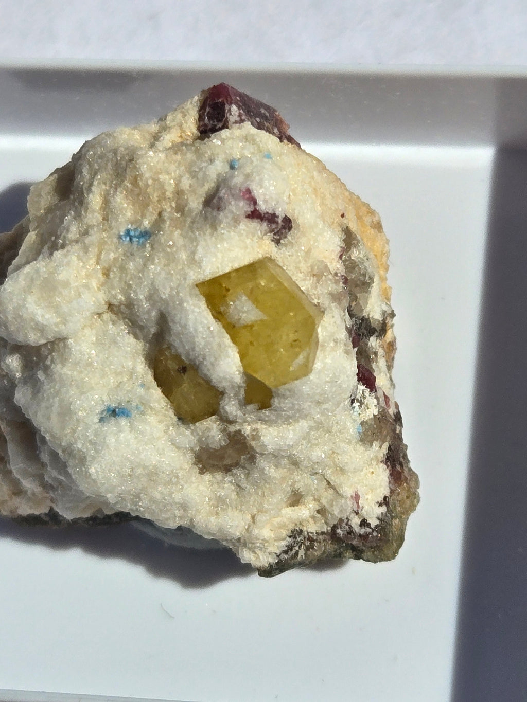 Rhodizite with tourmaline