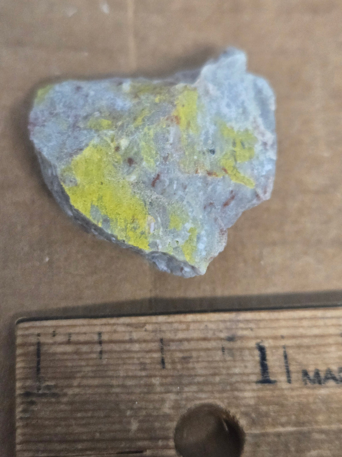 Carnotite weeksite specimen