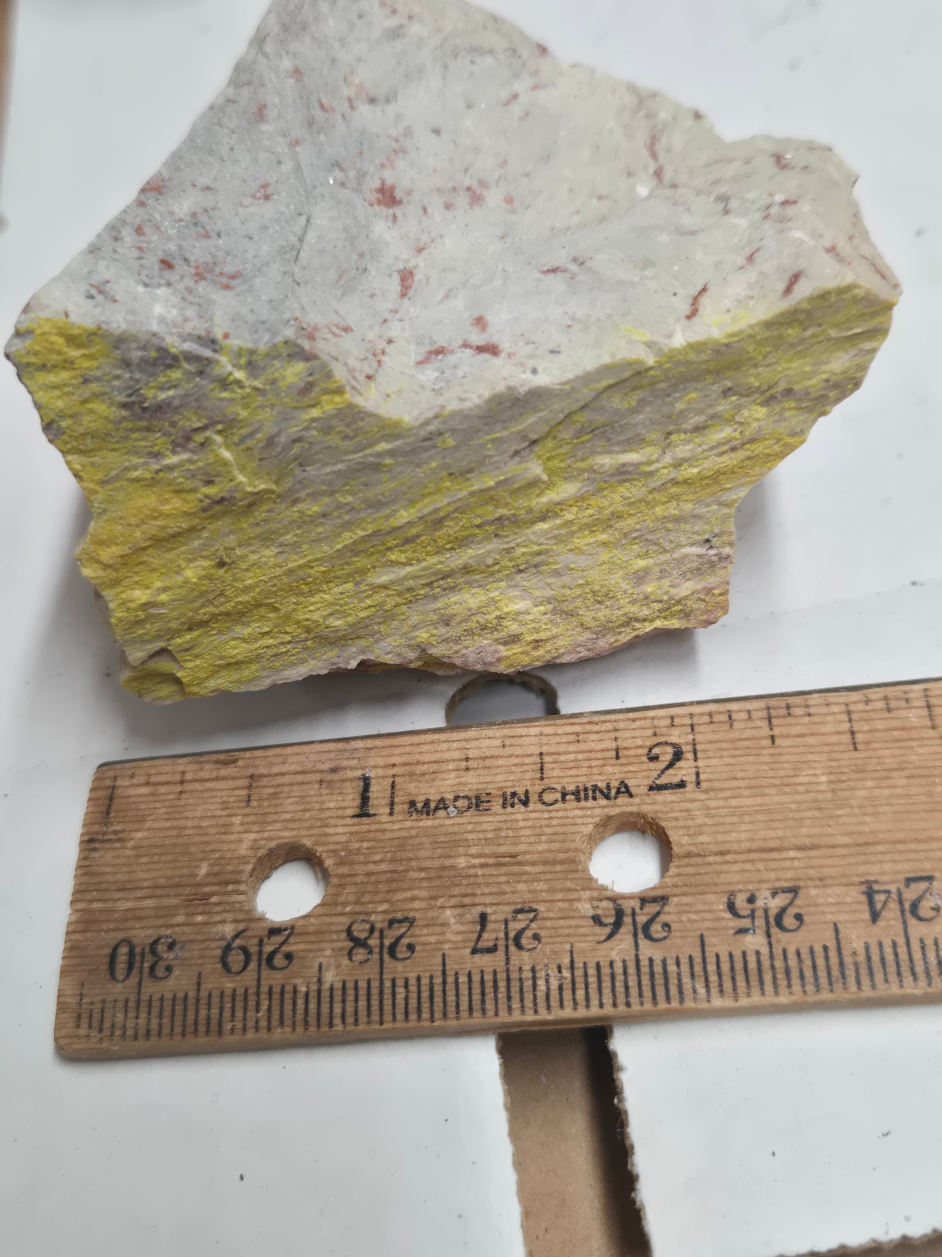 Carnotite weeksite specimen
