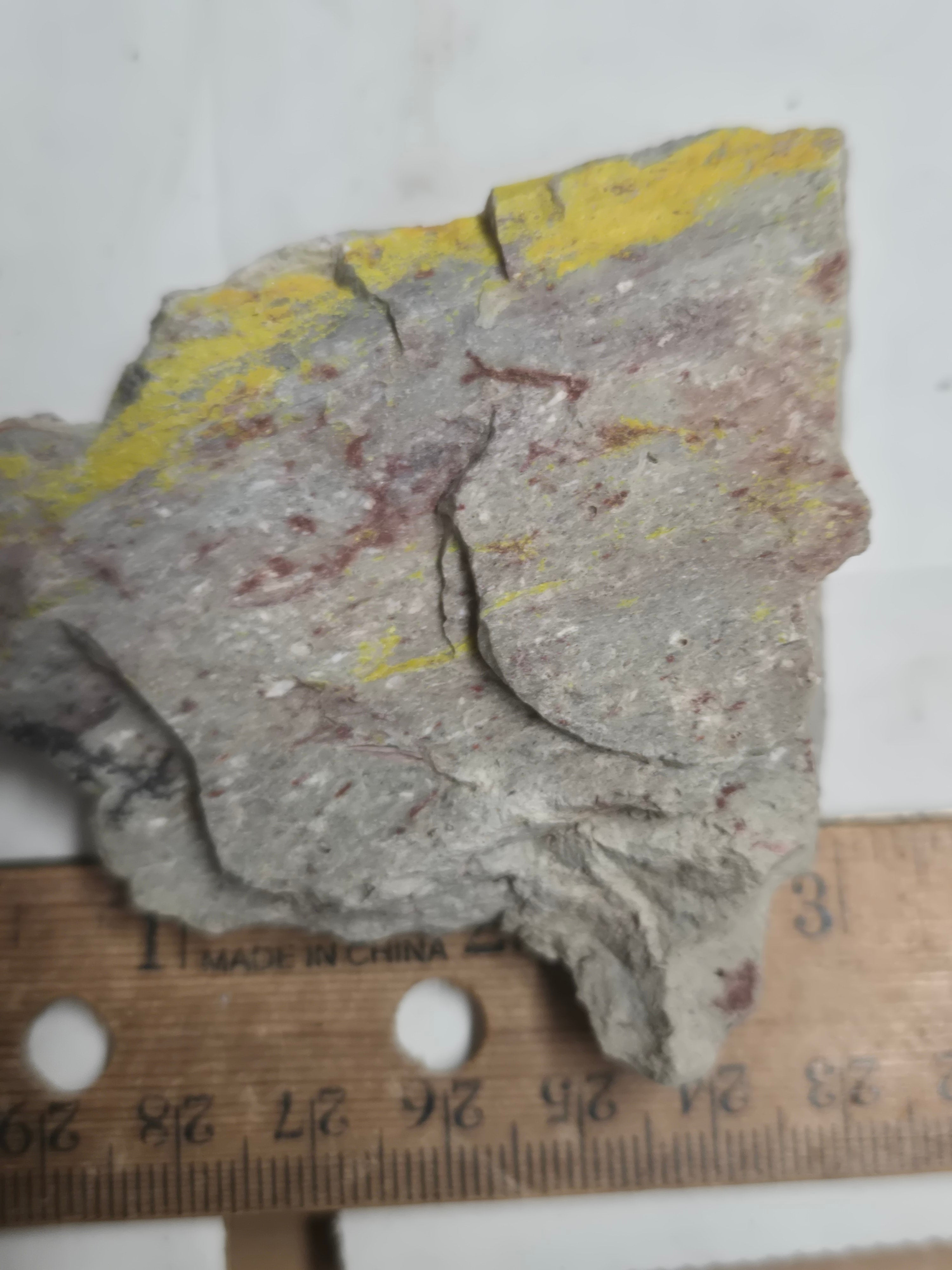 Carnotite weeksite specimen