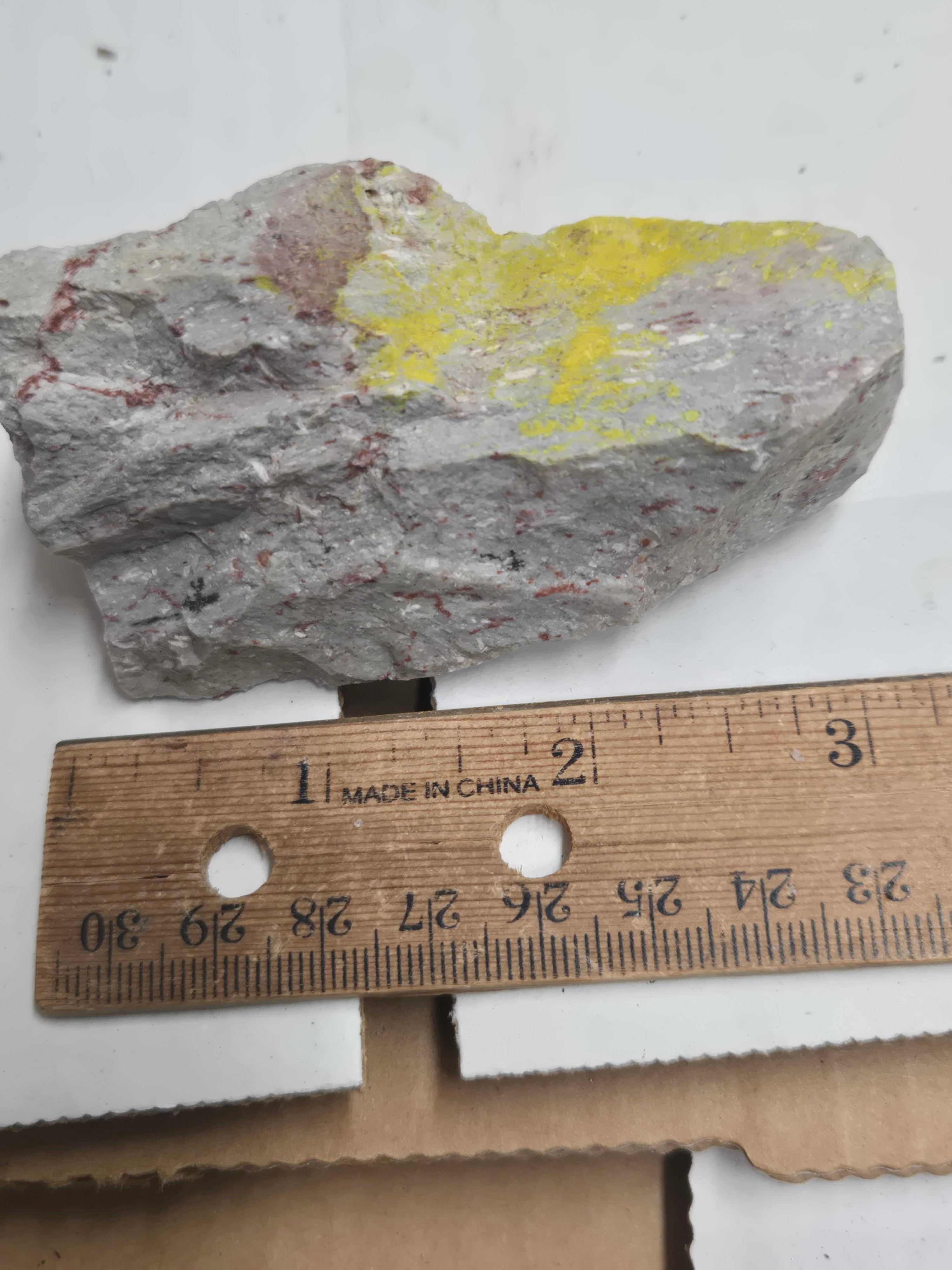 Carnotite weeksite specimen