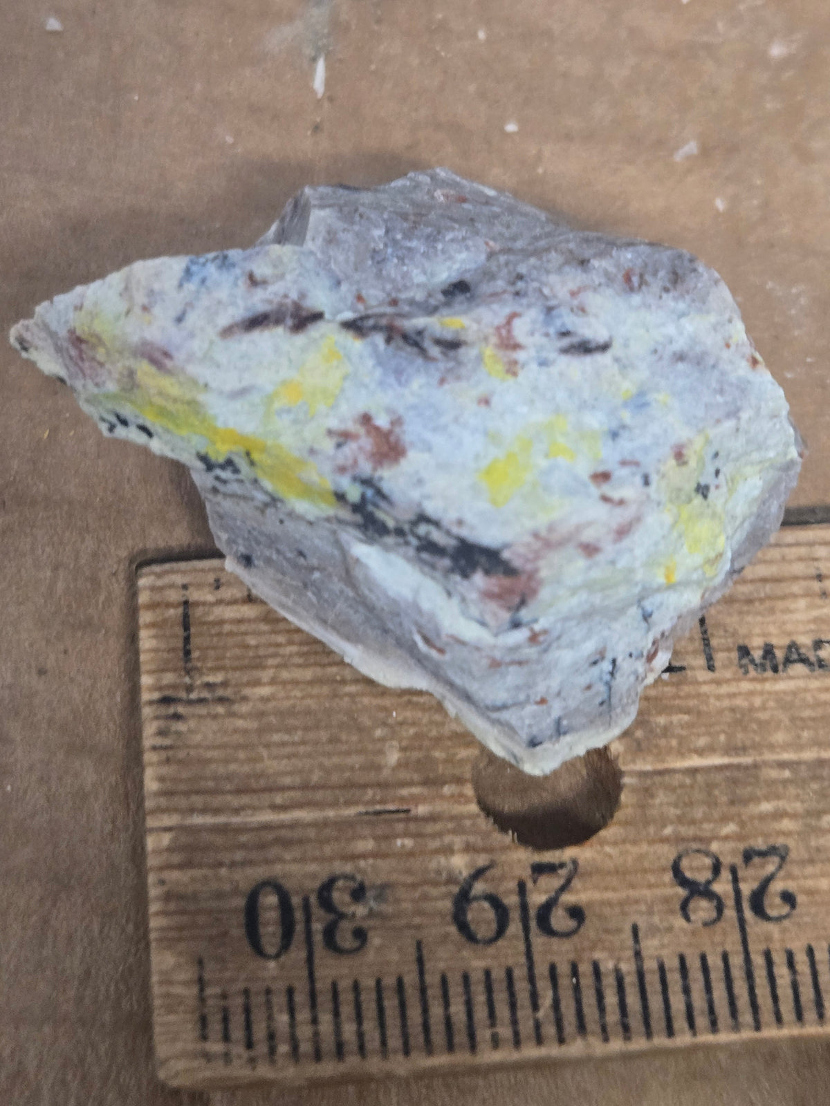 Carnotite weeksite specimen