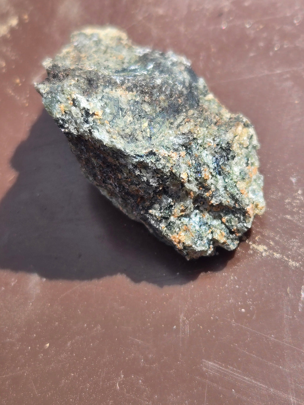 Rosenbuschite with fluoro-leakeite