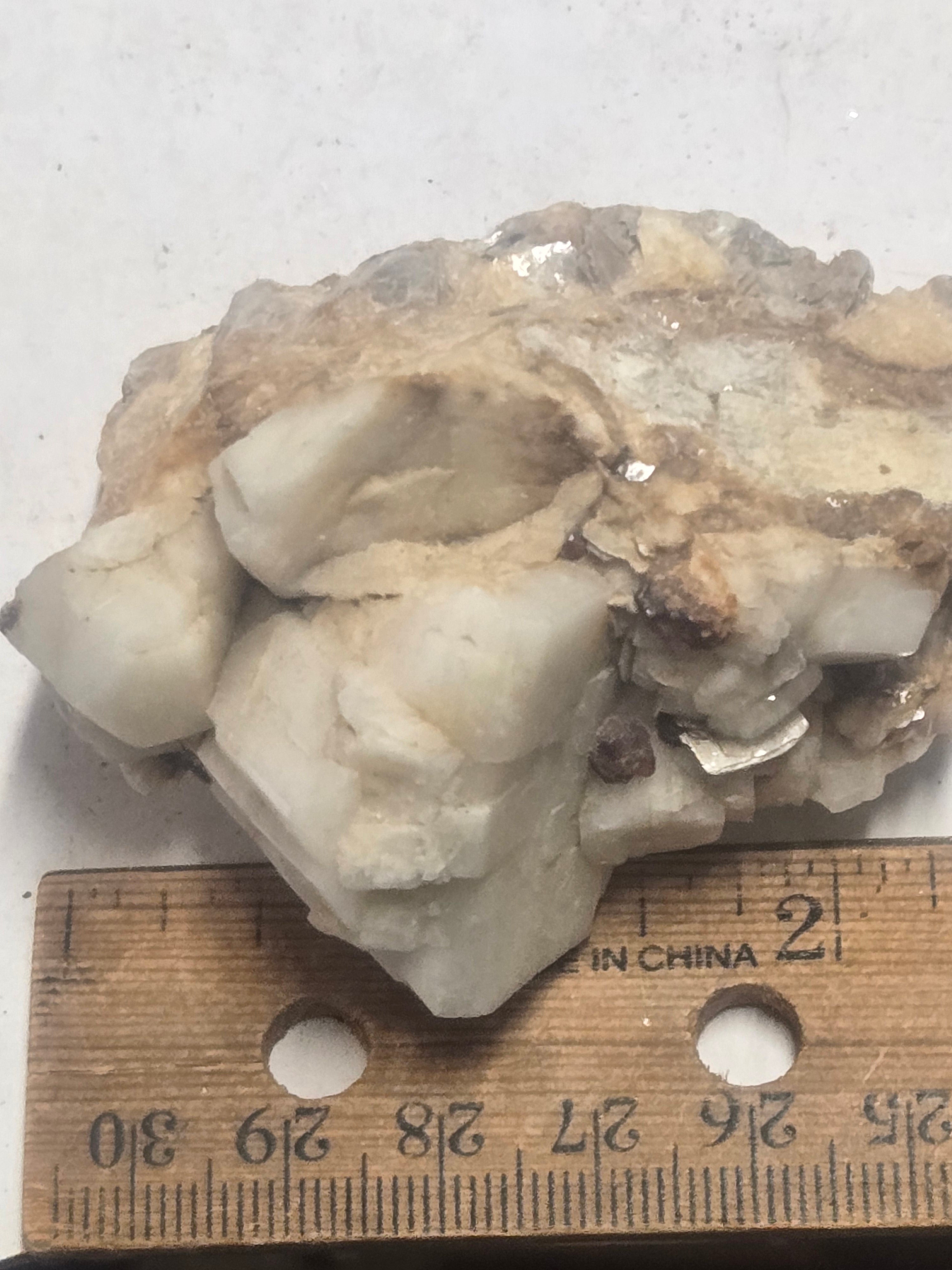 Spessartite on albite