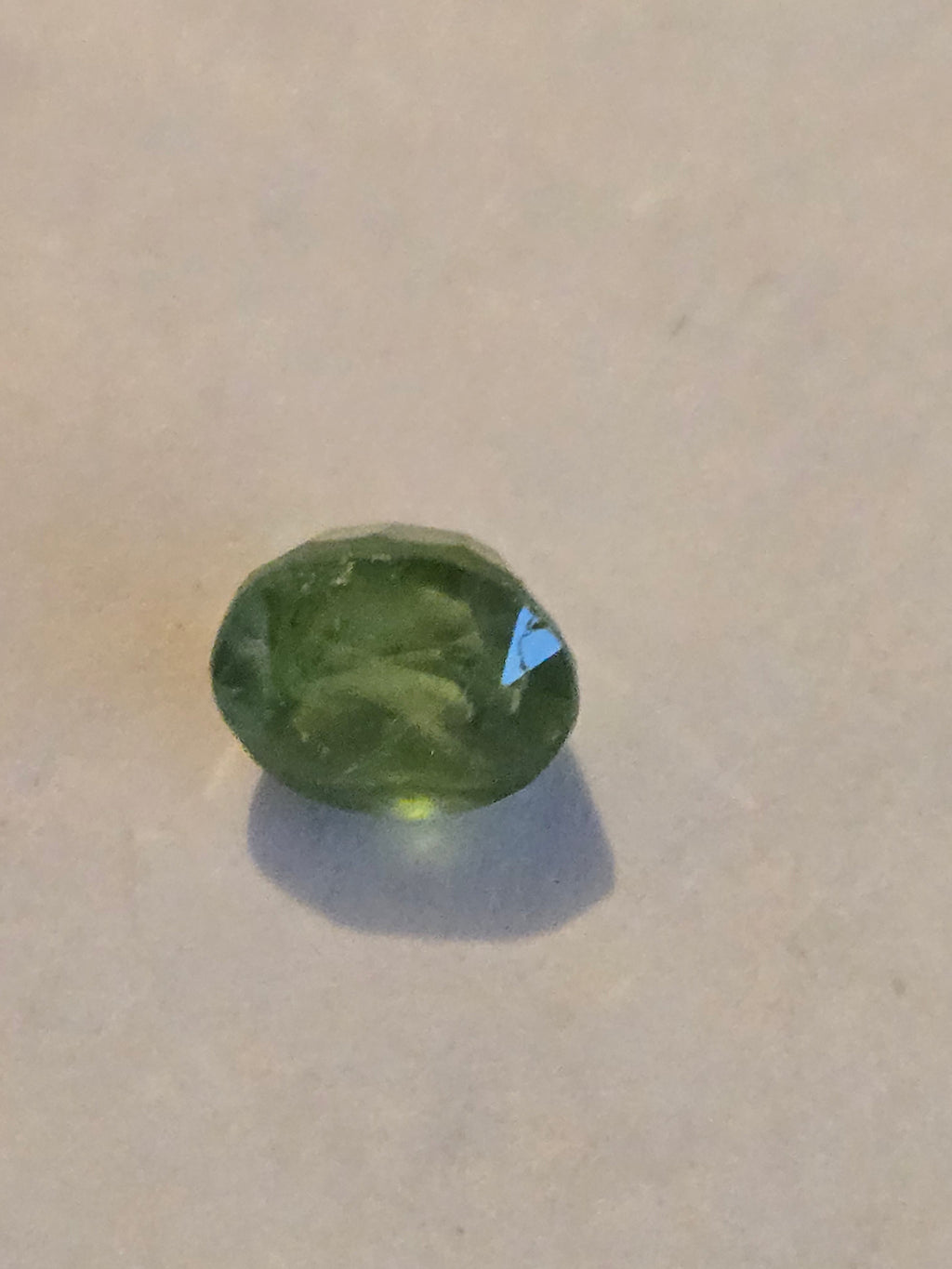 Tsavorite garnet facet