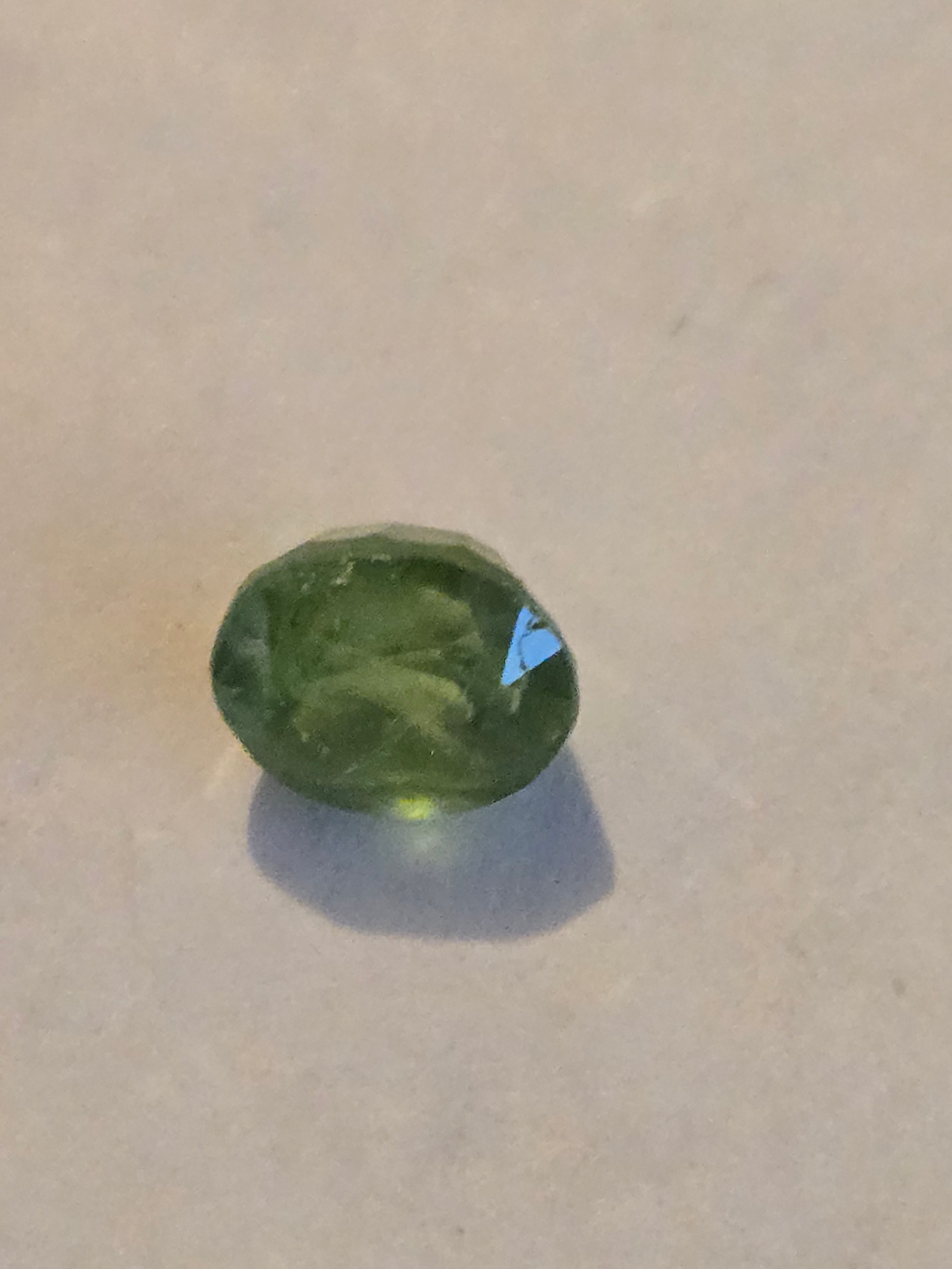 Tsavorite garnet facet
